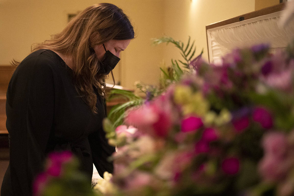 Sheila Hoonsan steps away from her family to have a moment alone with her mom's body at McKenzi ...