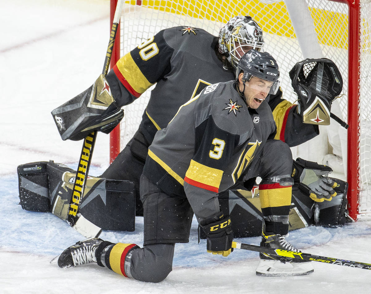 Golden Knights defenseman Brayden McNabb (3) takes a puck to the shin while defending the net w ...