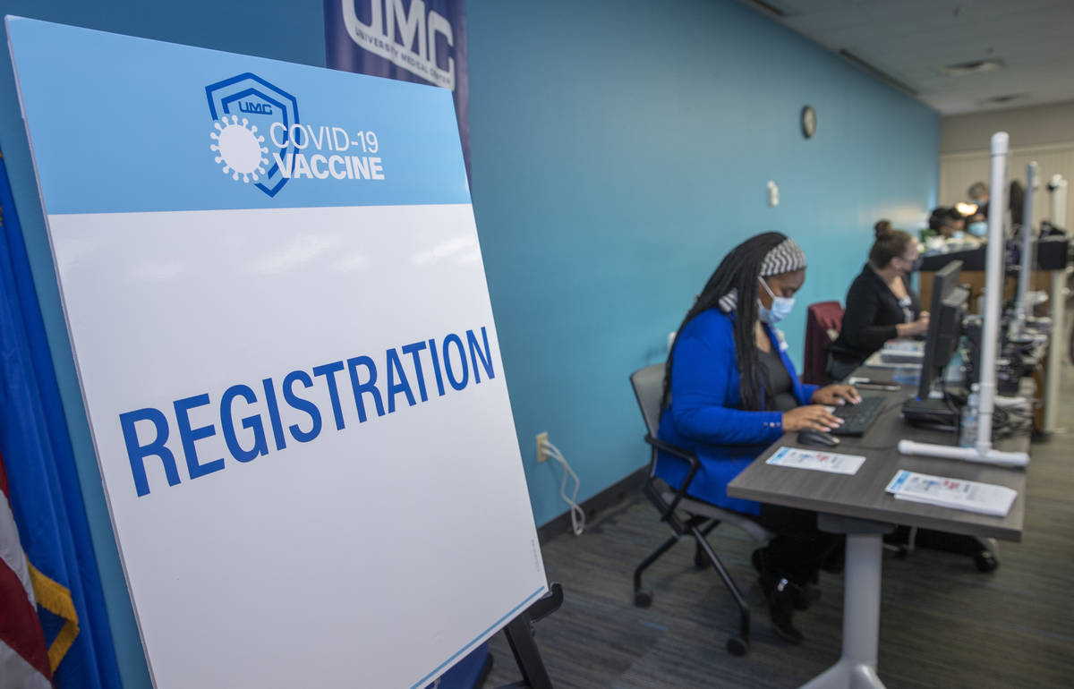 Registration table as University Medical Center front-line health care workers receive their Pf ...