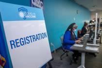 Registration table as University Medical Center front-line health care workers receive their Pf ...