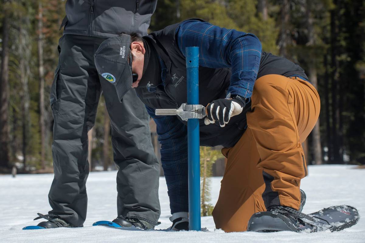 Sean de Guzman, chief of snow surveys for the California Department of Water Resources, checks ...