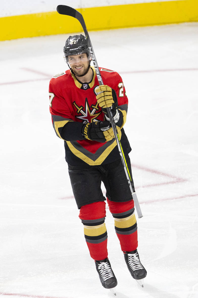 Golden Knights defenseman Shea Theodore (27) smiles after scoring a goal against the Kings duri ...