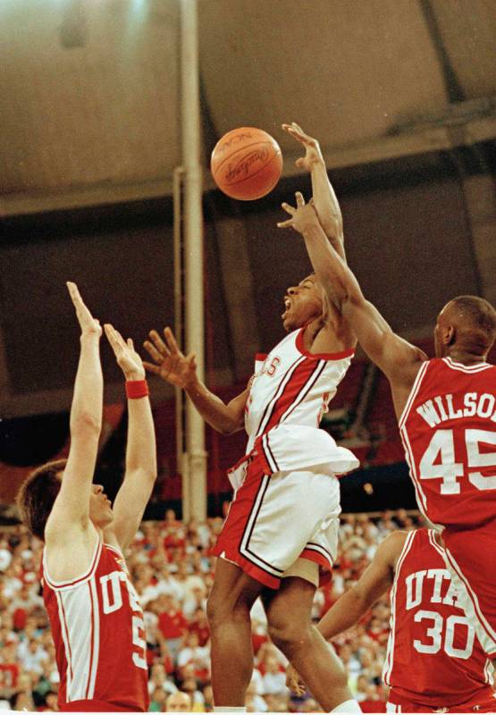 UNLV's Greg Anthony (50) goes to the basket between Utah's Josh Grant (5) and Byron Wilson (45) ...