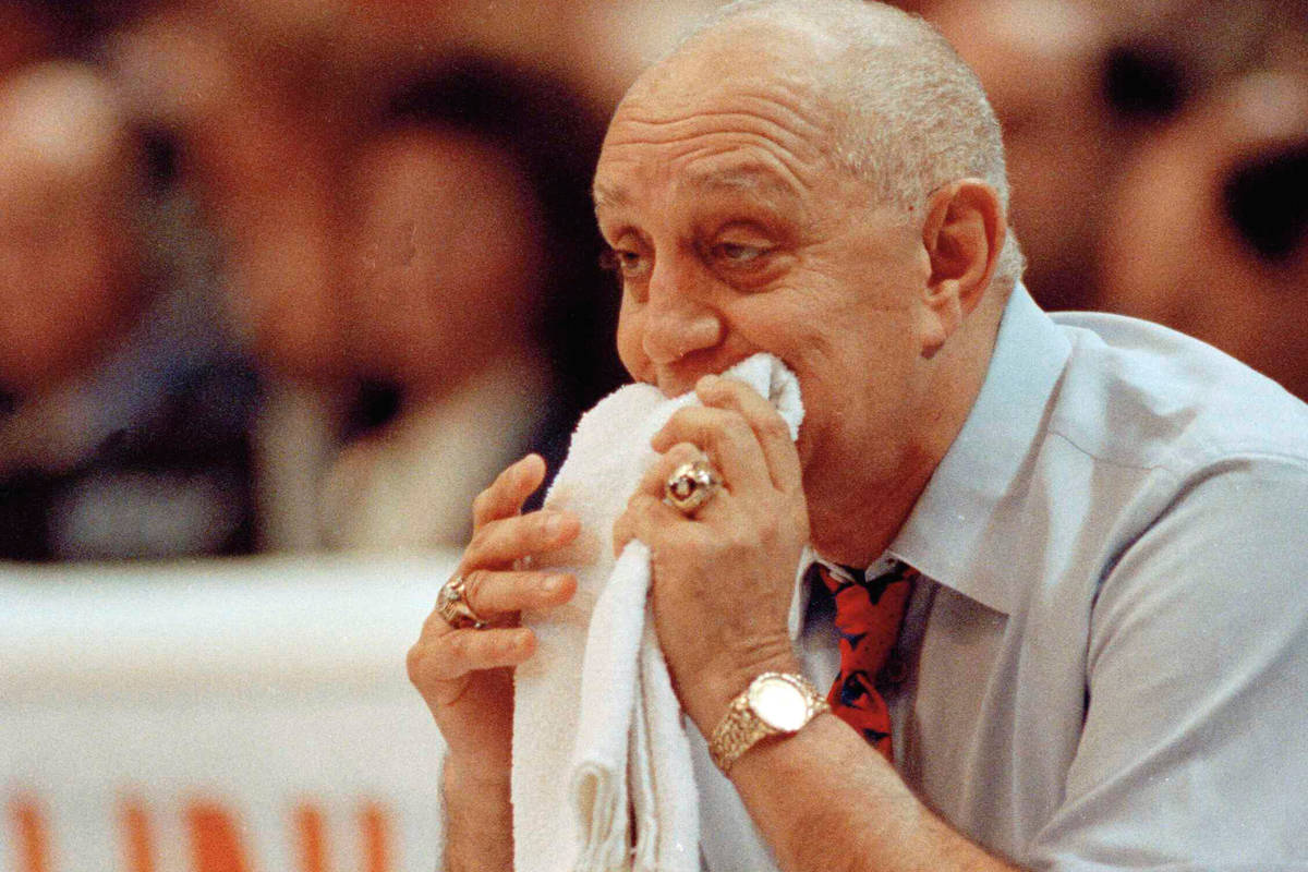 FILE - In this April 2, 1990, file photo, UNLV coach Jerry Tarkanian chews on his towel while w ...