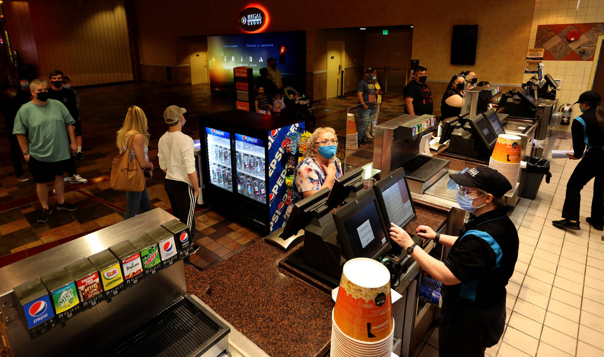 Beth Pollock serves Sharon Jylha of Las Vegas at Regal theaters at Red Rock Resort in Las Vegas ...