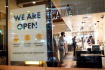 A sign advertises a restaurant opening in Santa Monica, Calif., in March 2021. (AP Photo/Marcio ...