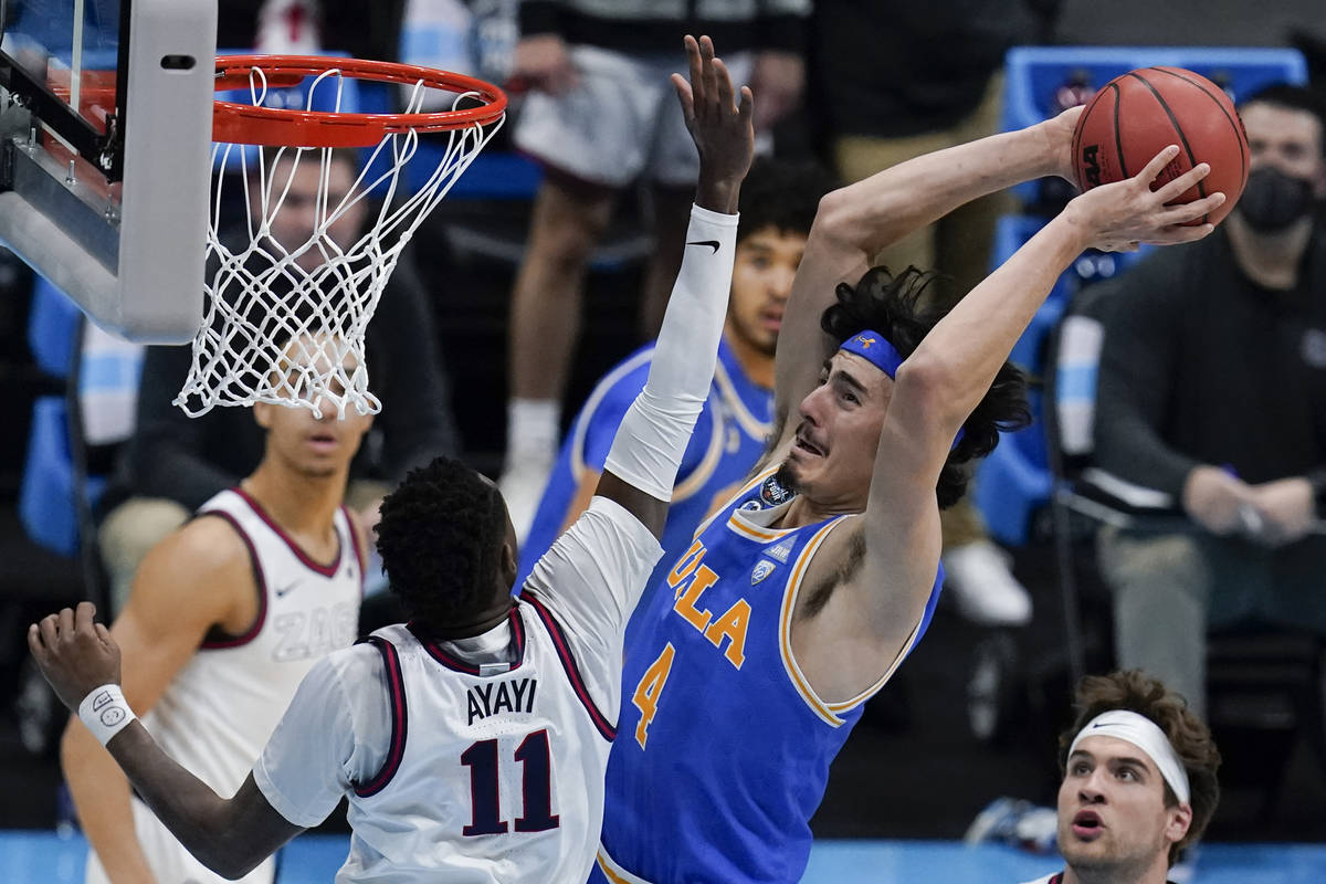 UCLA guard Jaime Jaquez Jr. (4) shoots over Gonzaga guard Joel Ayayi (11) during the first half ...