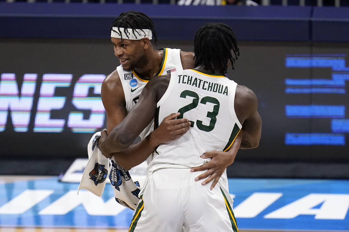 FILE - Baylor forward Flo Thamba, rear, and Jonathan Tchamwa Tchatchoua (23) react to a play ag ...