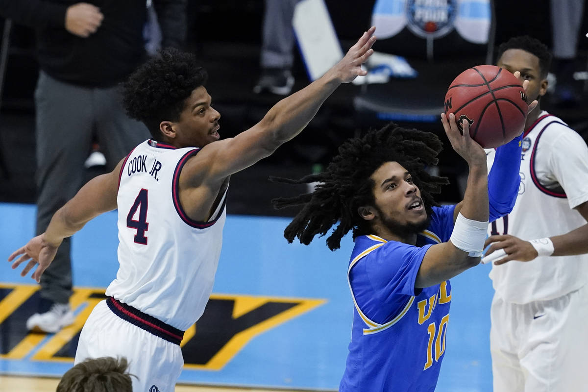 UCLA guard Tyger Campbell (10) shoots ahead of Gonzaga guard Aaron Cook (4) during the second h ...