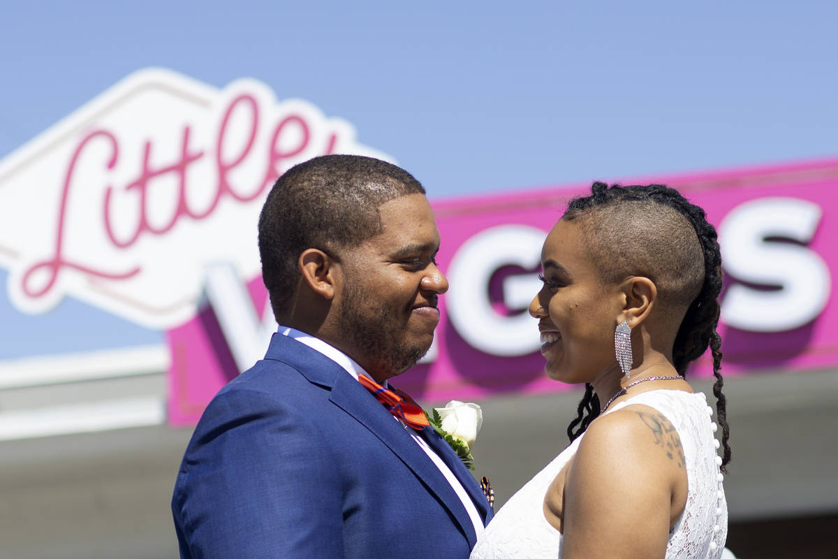 Michael Durham and Khiana Allen, of Texas, are photographed after getting married at the Little ...