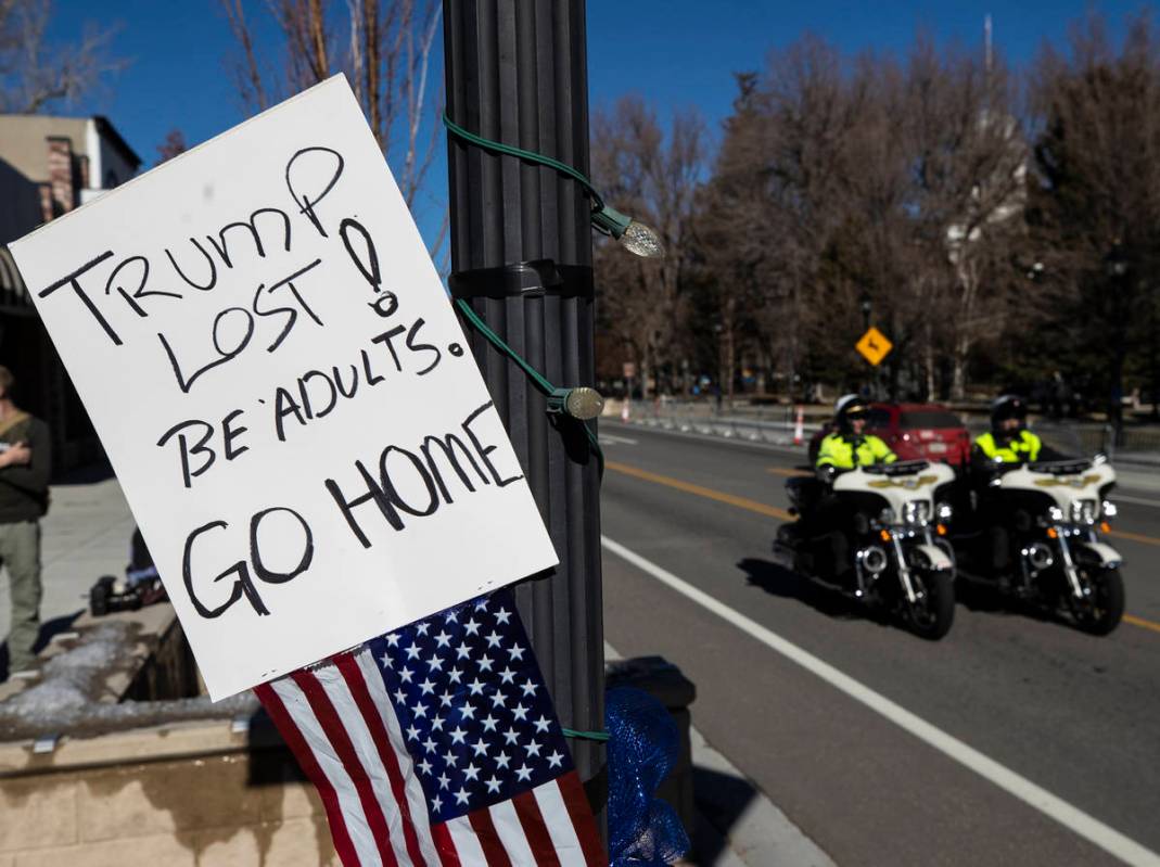 Law enforcement patrol the state Capitol complex on Sunday, Jan. 17, 2021, in Carson City. (Ben ...