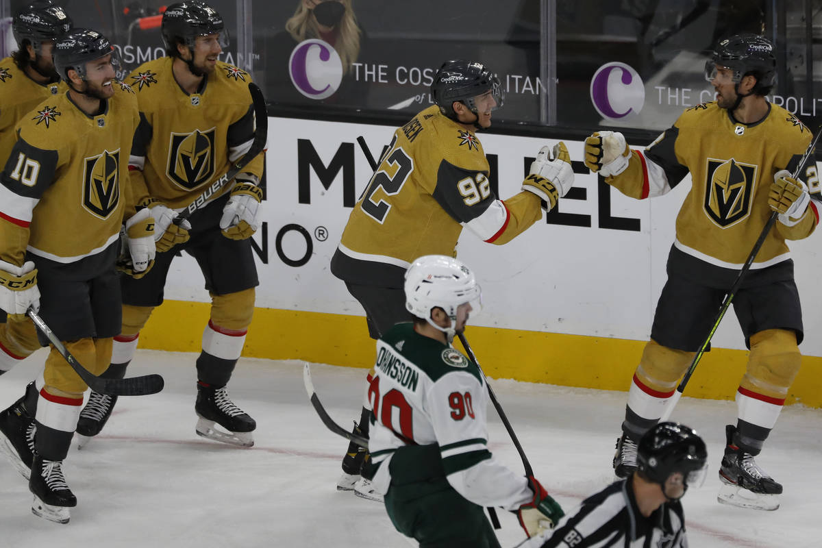 Vegas Golden Knights defenseman Shea Theodore (27), right, congratulates Vegas Golden Knights l ...