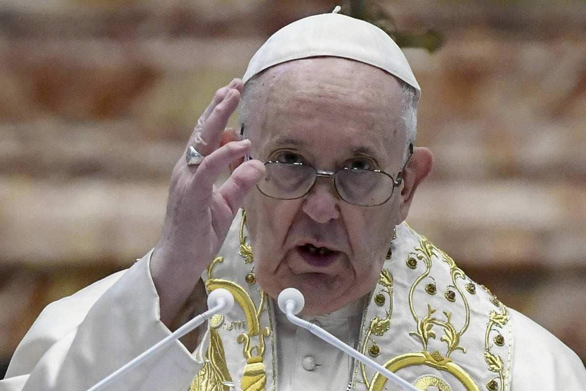 Pope Francis delivers his Urbi et Orbi blessing after celebrating Easter Mass at St. Peter's Ba ...