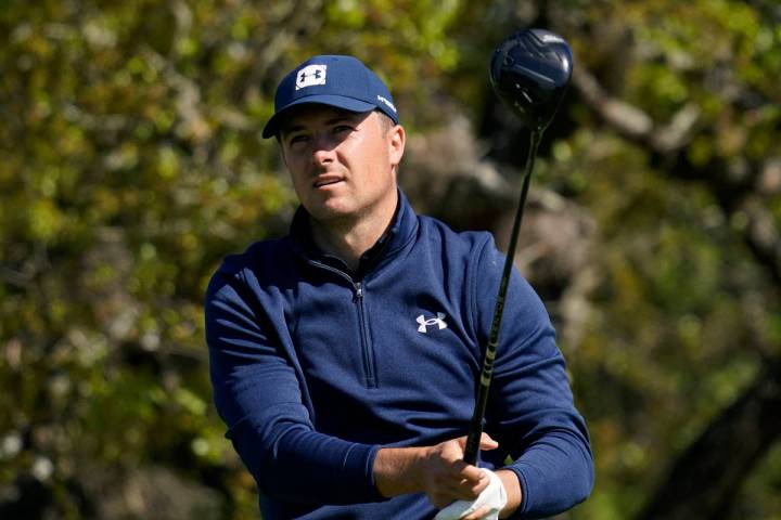 Jordan Spieth watches his drive from the second tee during the first round of the Texas Open go ...