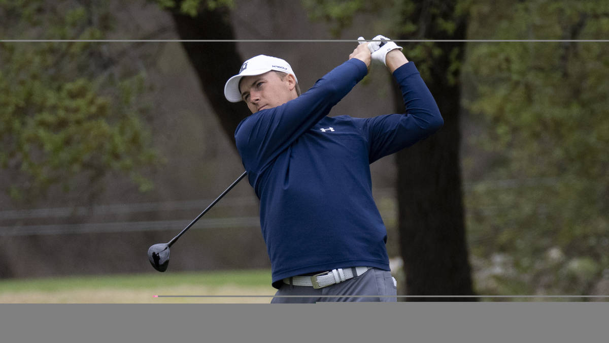 Jordan Spieth follows through on his swing on the 2nd hole during the third round of the Valero ...