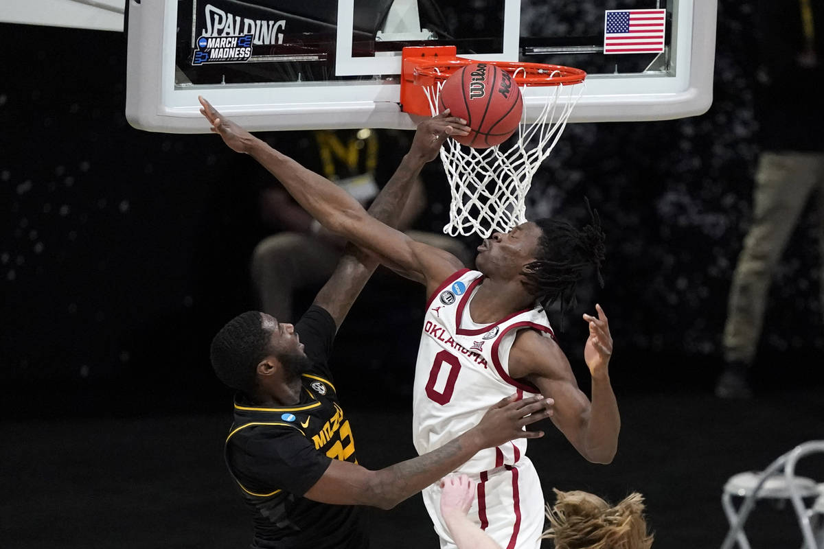 Missouri forward Jeremiah Tilmon misses a dunk in front of Oklahoma forward Victor Iwuakor (0) ...