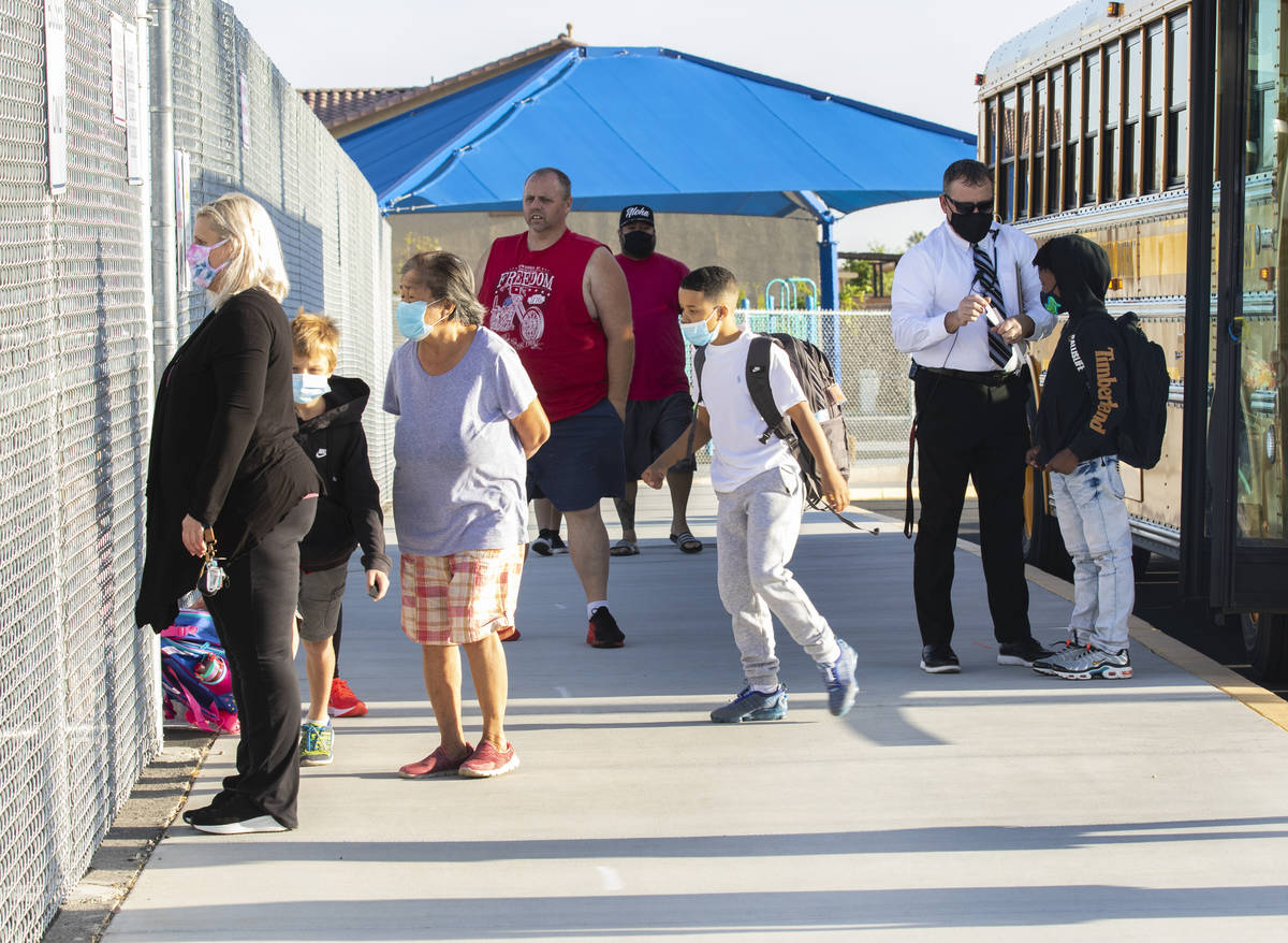 Students arrive at Tyrone Thompson Elementary School for full-time in-person instruction, on Tu ...