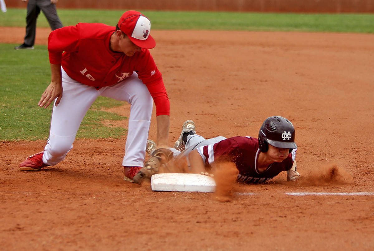 Arbor View's Jacob Scioli (16) attempts to tag out Cimarron-Memorial's Ethan Daniel (17) in th ...