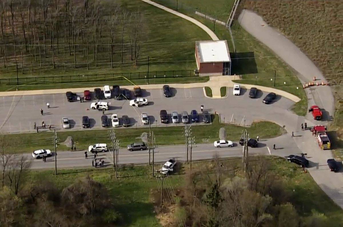 This photo provided by WJLA, police respond to the scene of a shooting in in Frederick, Md., on ...
