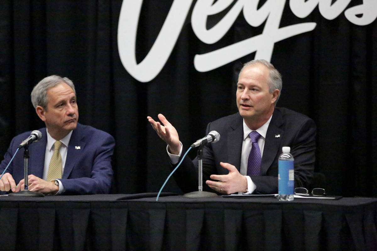 Brian Yost, LVCVA chief operating officer, left, looks on while Steve Hill, LVCVA president and ...
