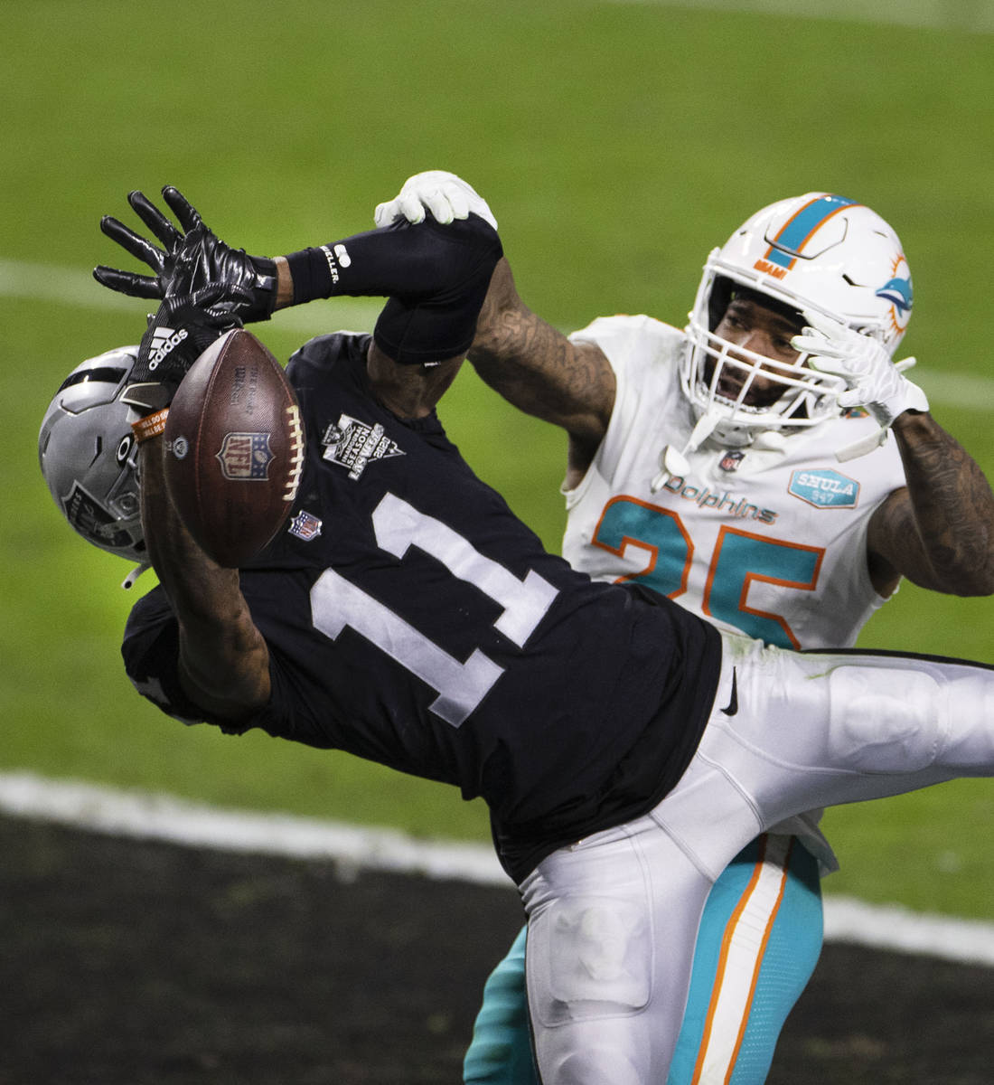 Raiders wide receiver Henry Ruggs III (11) is unable to catch the ball as Miami Dolphins corner ...