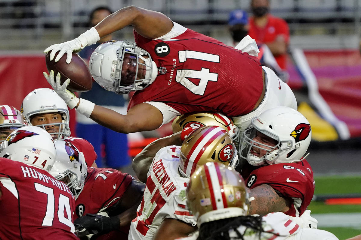 FILE - Arizona Cardinals running back Kenyan Drake (41) dives over the line for a touchdown aga ...
