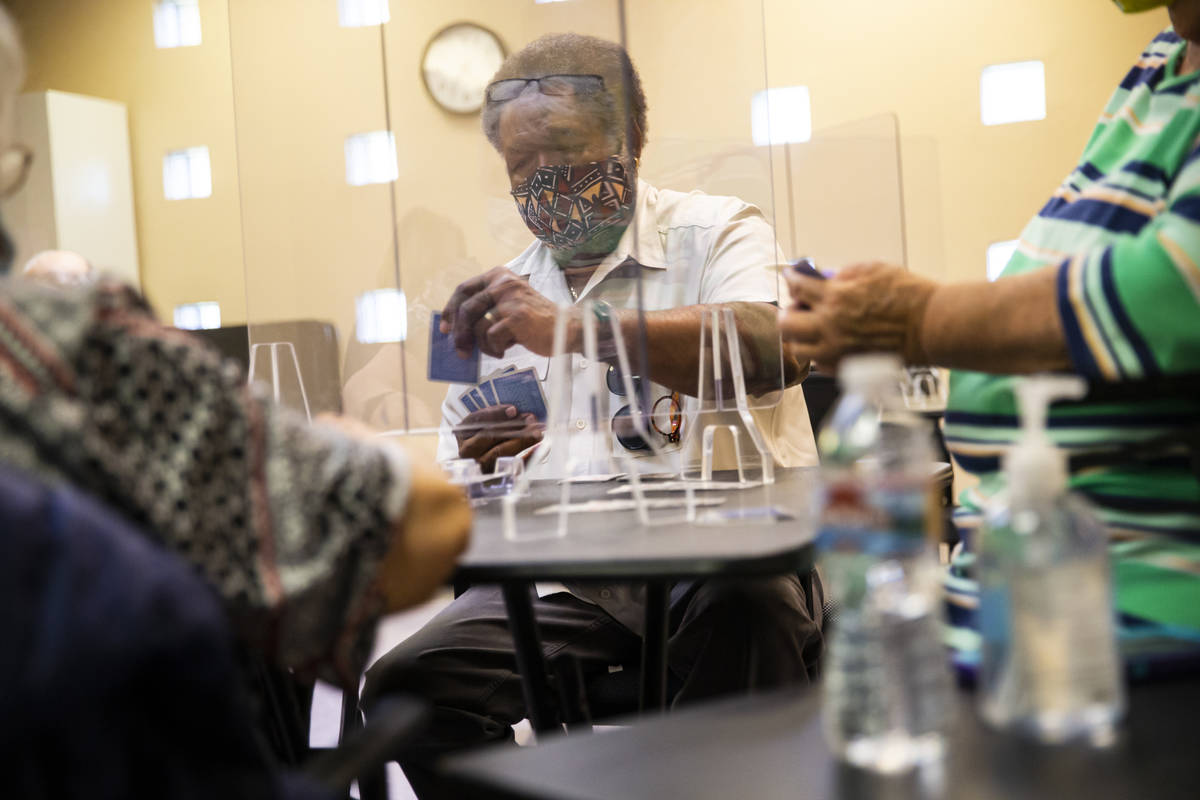 Gordon Dew plays the card game canasta at the West Flamingo Senior Center during the first day ...