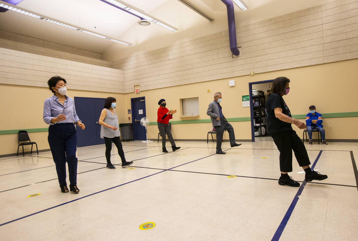 Dance instructor Irma Achey, right, leads a line dancing class at the West Flamingo Senior Cent ...