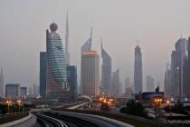 This Sept. 18, 2009 picture shows Burij Dubai, world's tallest tower under construction, center ...