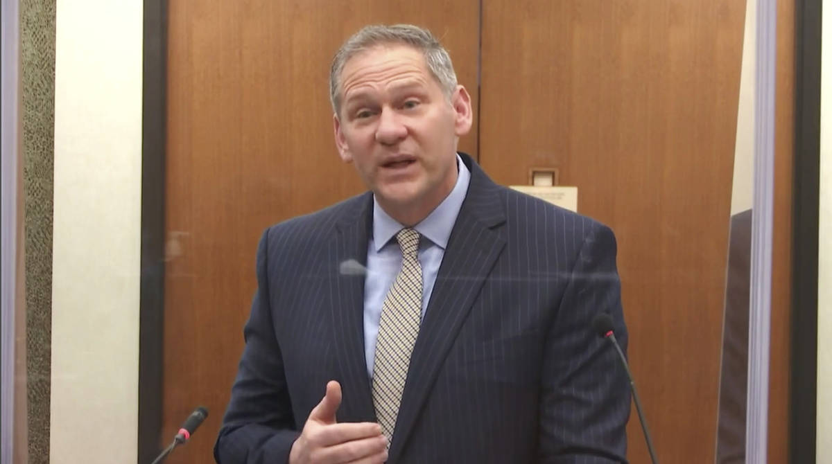 In this image from video, prosecutor Steve Schleicher questions witness Los Angeles police ...
