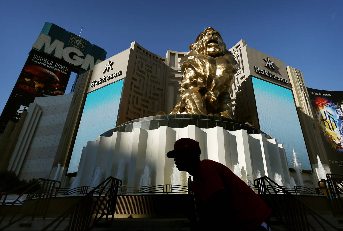 In this Aug. 3, 2015, file photo, a man rides his bike past the MGM Grand hotel and casino in L ...