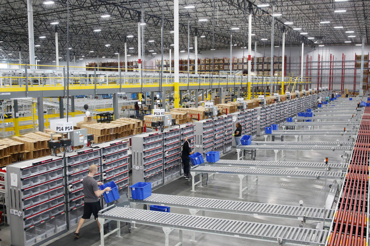 Warehouse workers sort products at the Sephora distribution center in North Las Vegas on Friday ...