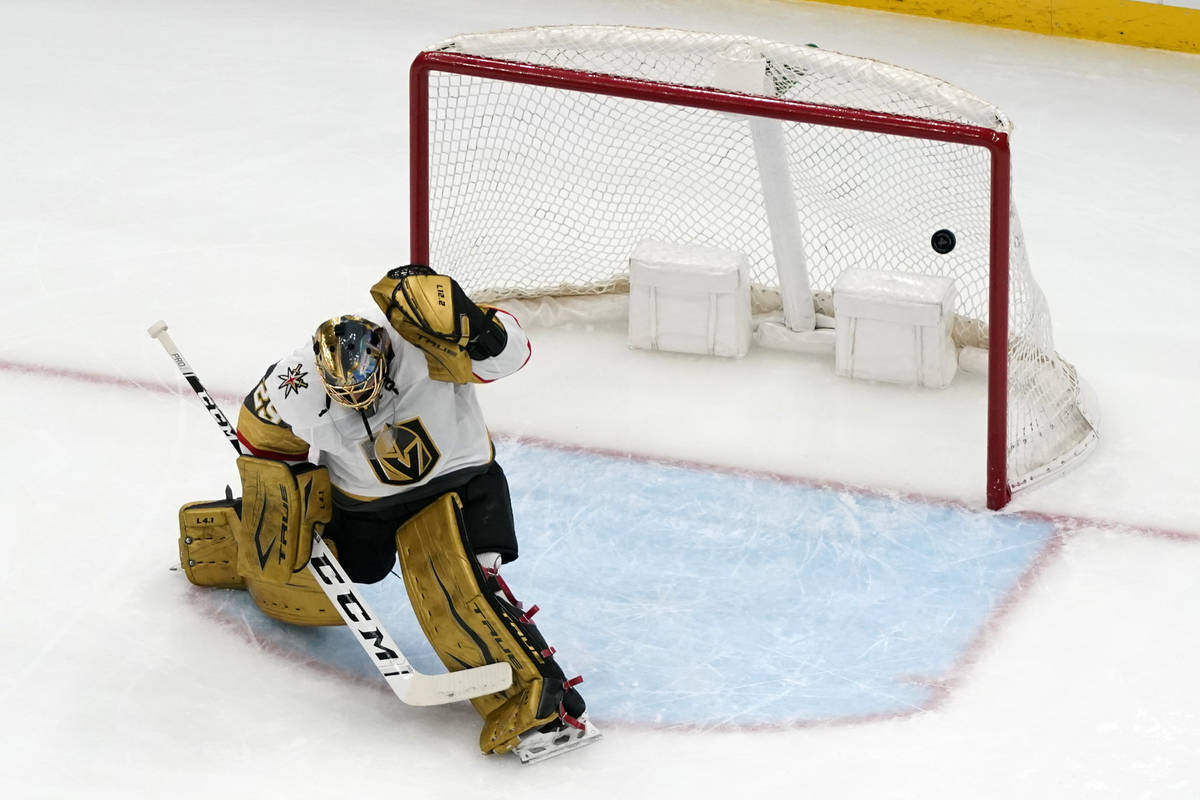 A puck shot by St. Louis Blues' Sammy Blais slips past Vegas Golden Knights goaltender Marc-And ...