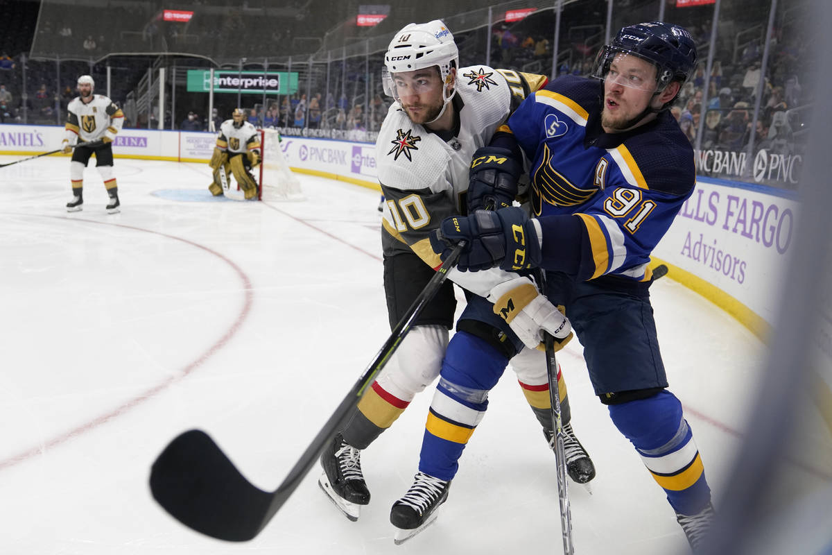 St. Louis Blues' Vladimir Tarasenko, right, gets tangled up with Vegas Golden Knights' Nicolas ...