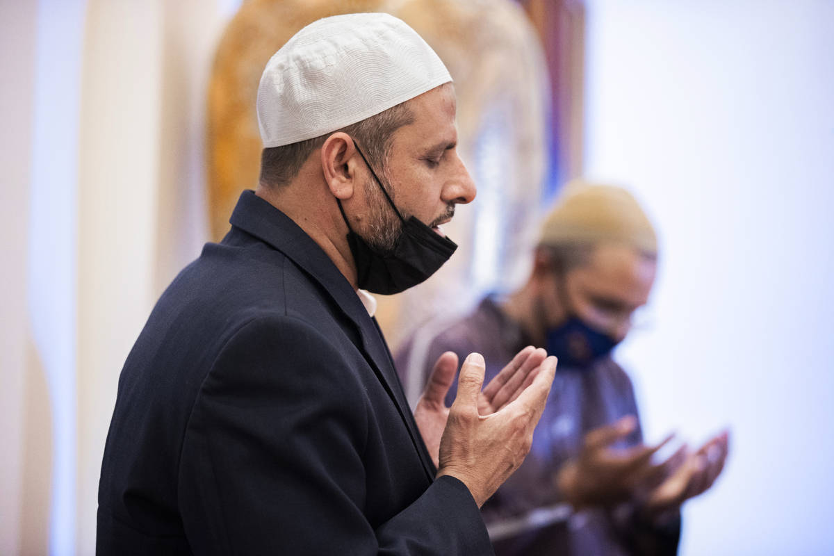 Najib Jabarkhil, left, speaks during prayer at the Masjid Ibrahim Islamic Center on Friday, Apr ...