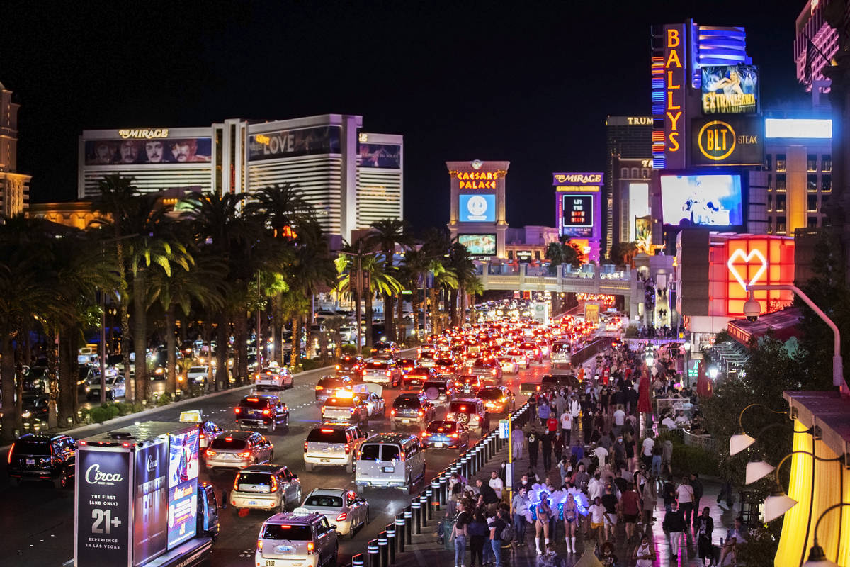 The Strip is packed outside Paris Las Vegas on Friday, March 19, 2021, in Las Vegas. (Benjamin ...