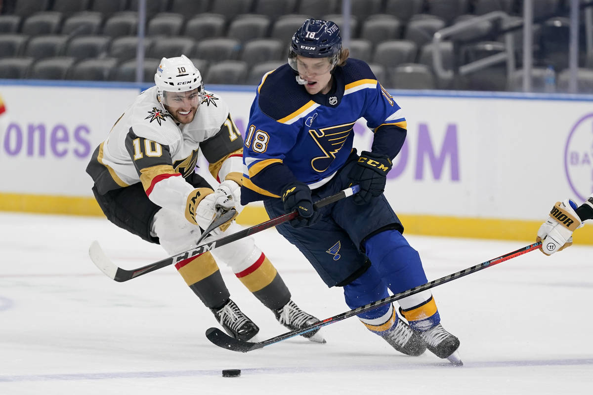 St. Louis Blues' Robert Thomas (18) controls the puck as Vegas Golden Knights' Nicolas Roy (10) ...