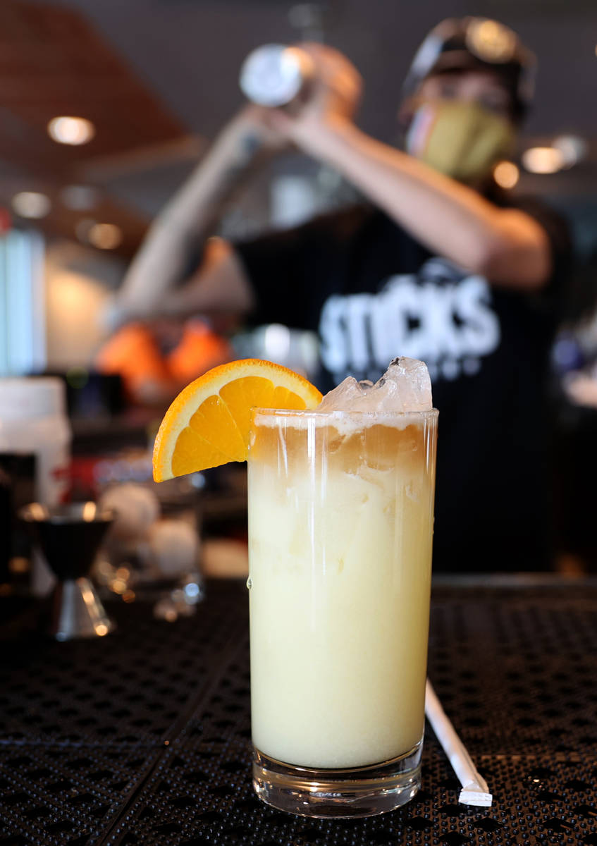 Bartender Virginia Douglass makes the Chance's Colada at Sticks Tavern on Water Street in downt ...