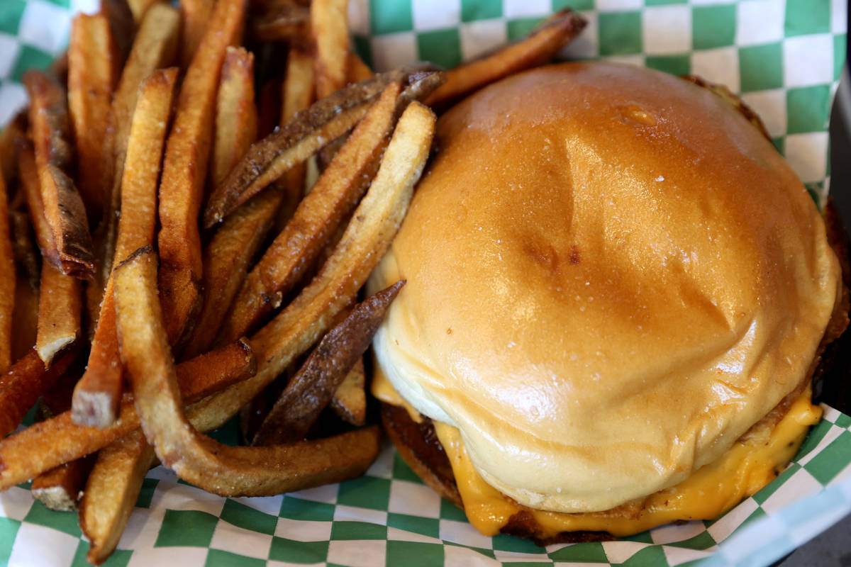 The Sticks Burger and fries. at Sticks Tavern on Water Street in downtown Henderson. The owner ...