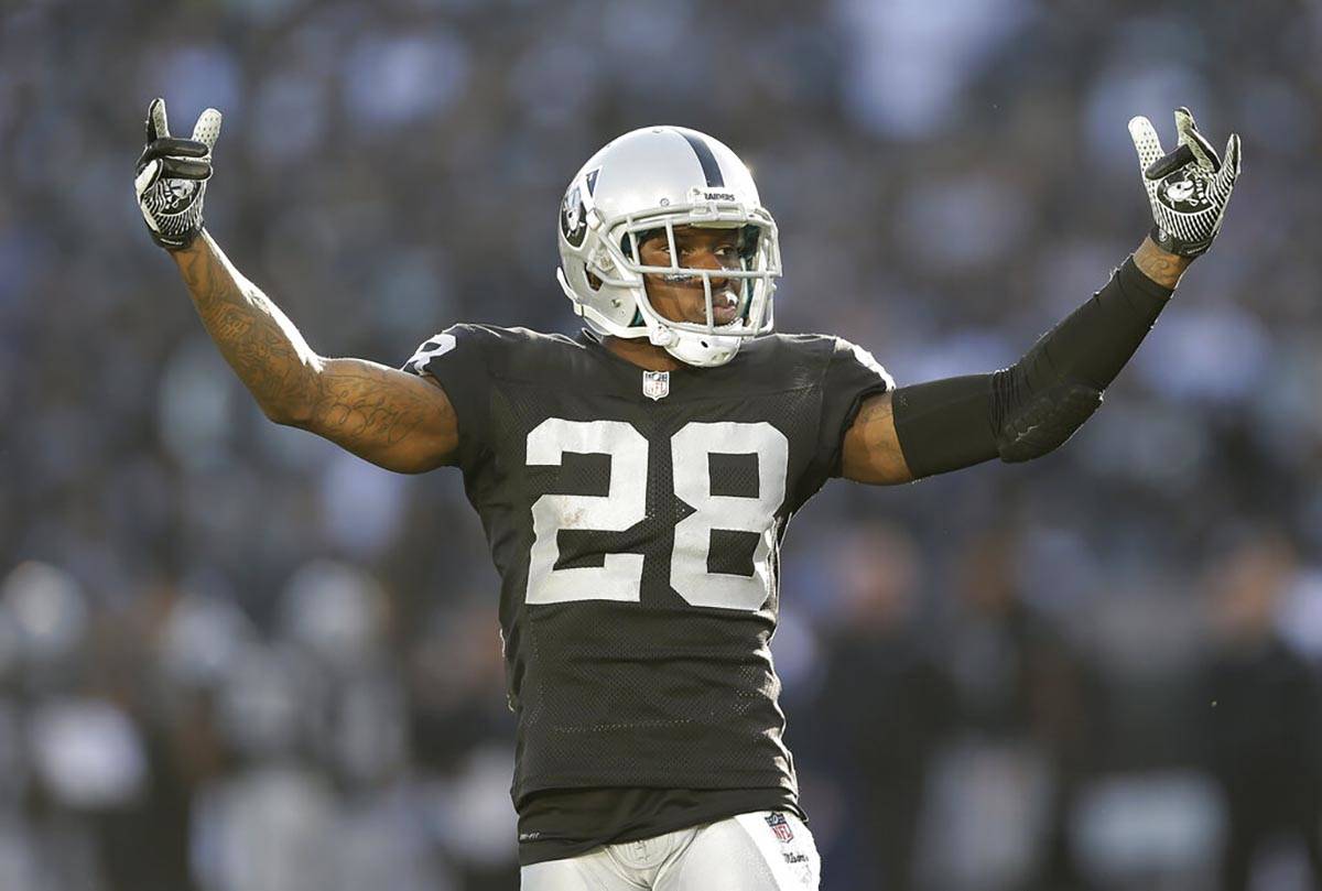 In this Dec. 15, 2013 file photo, Oakland Raiders defensive back Phillip Adams (28) gestures wh ...