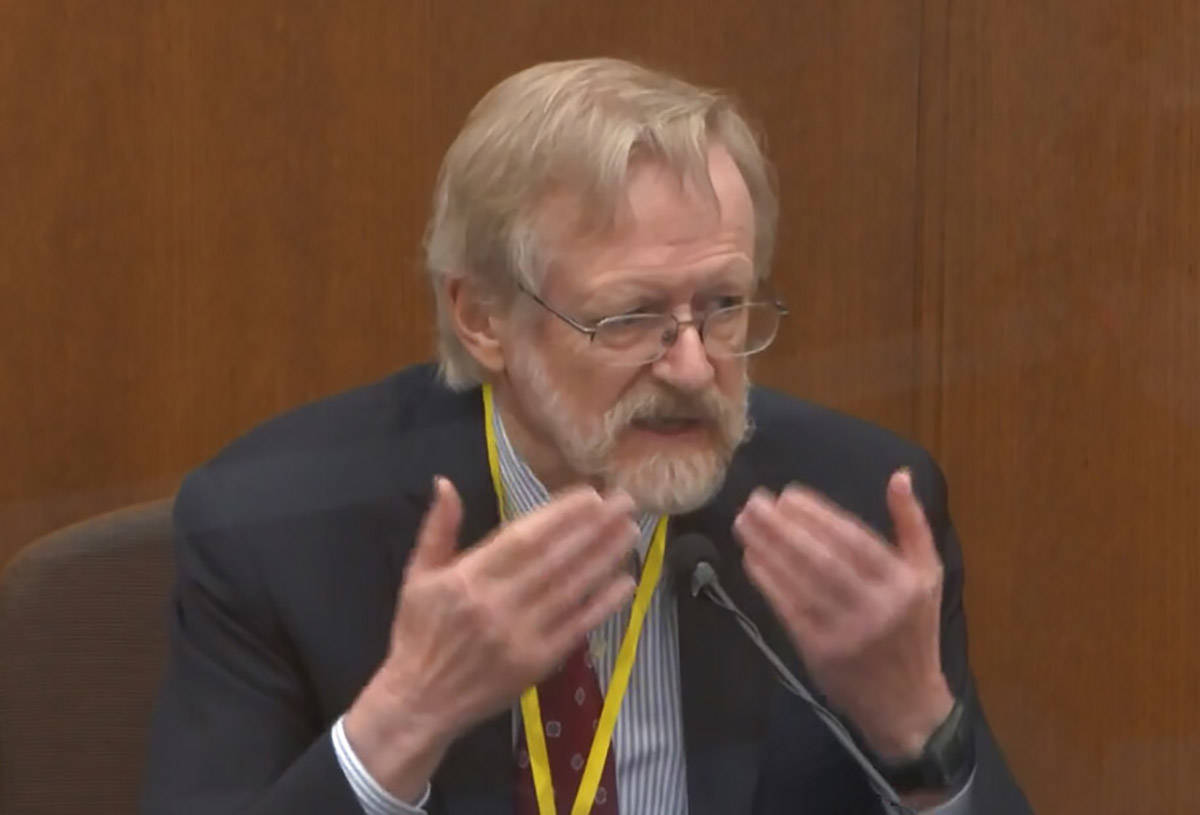 In this image from video, Dr. Martin Tobin testifies as Hennepin County Judge Peter Cahill ...