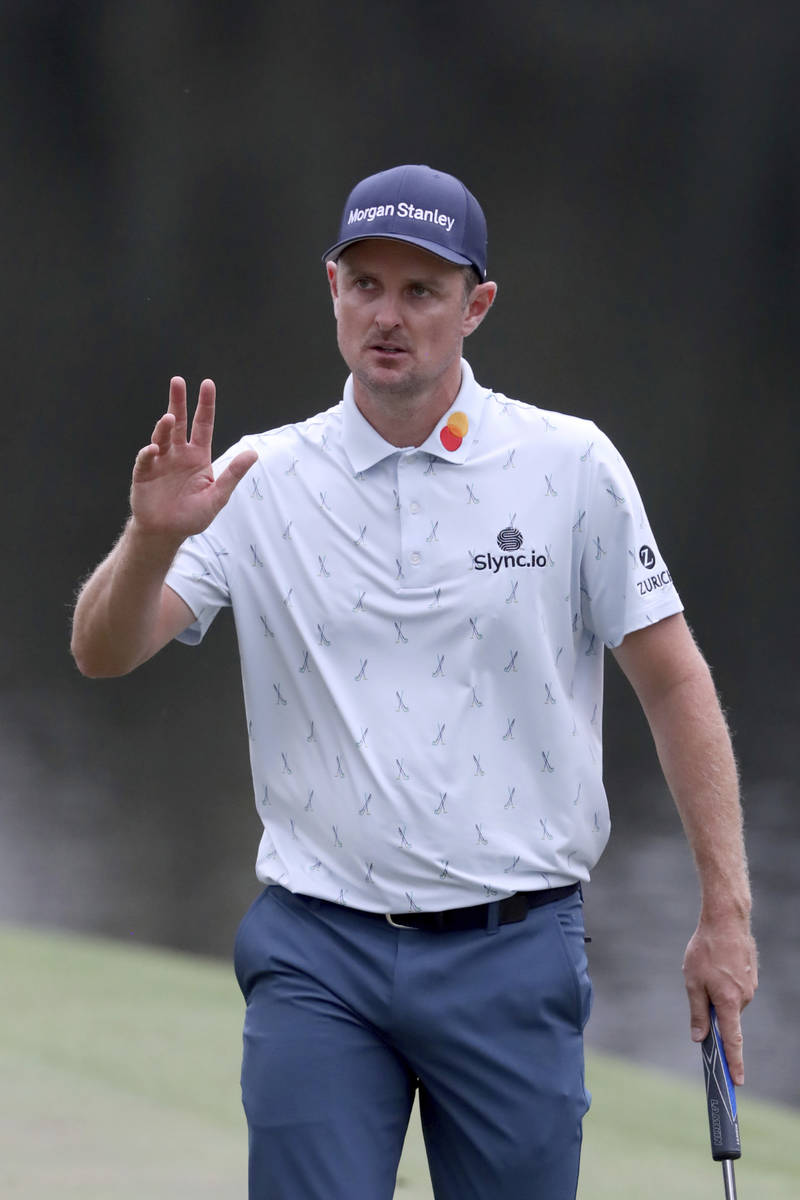 Justin Rose reacts to making a birdie on the sixteenth hole during the first round of the Maste ...