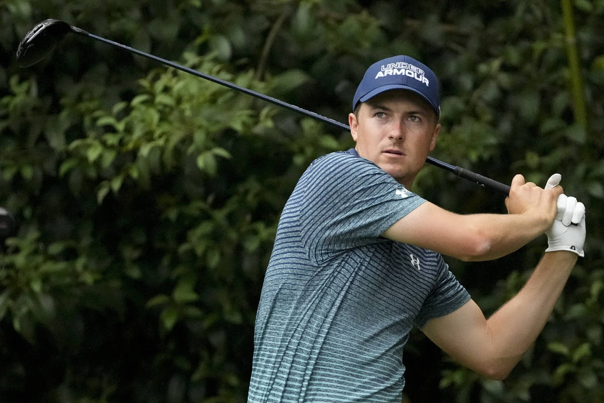 Jordan Spieth watches his drive on the 14th tee during the first round of the Masters golf tour ...