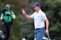 Justin Rose reacts to his birdie shot on the seventeenth hole during the first round of the Mas ...
