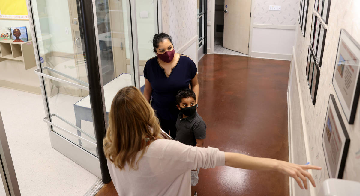 Preschool Director Tracy Kessler gives a tour to Nav Chohan and her son Aydin, 4, at Capstone C ...