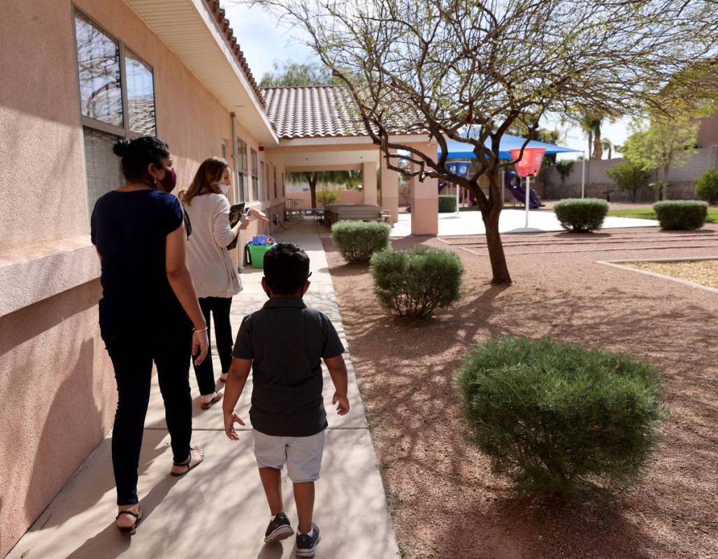 Preschool Director Tracy Kessler gives a tour to Nav Chohan and her son Aydin, 4, at Capstone C ...