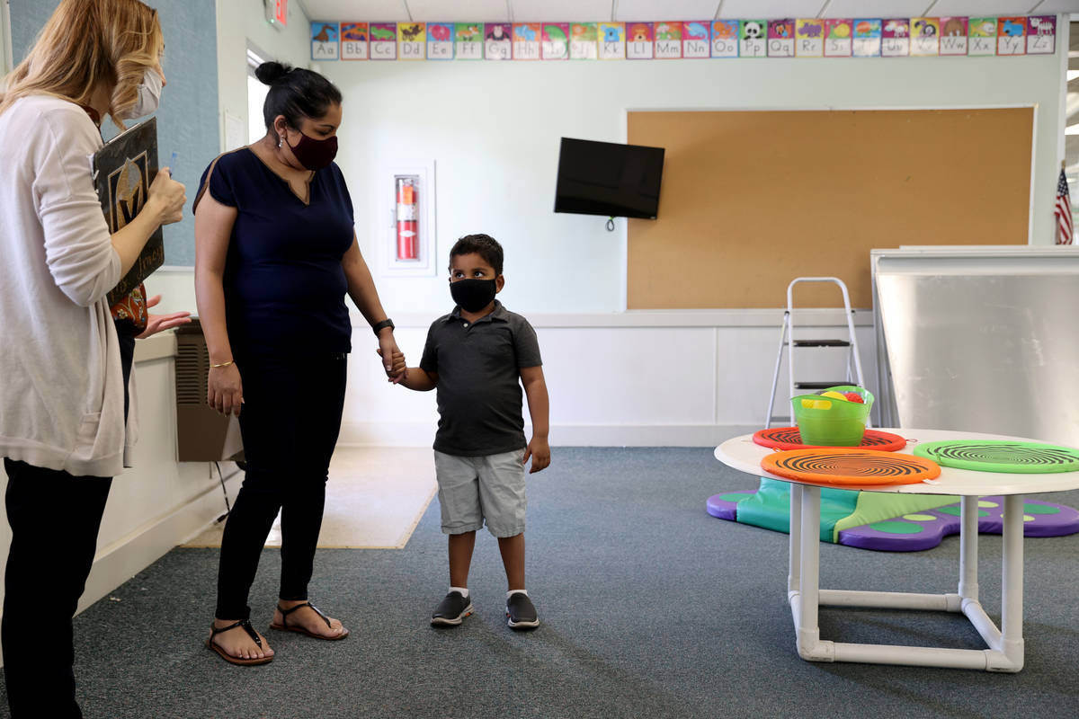 Preschool Director Tracy Kessler gives a tour to Nav Chohan and her son Aydin, 4, at Capstone C ...