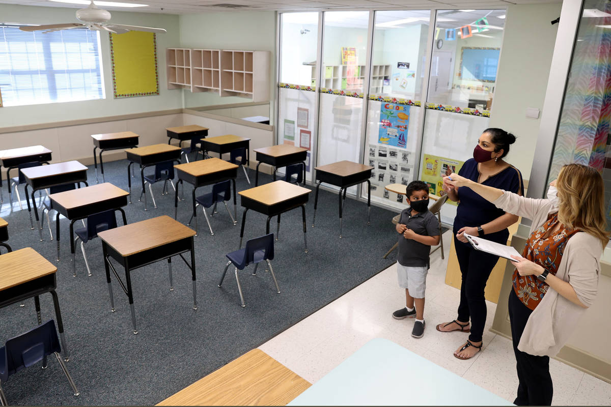Preschool Director Tracy Kessler gives a tour to Nav Chohan and her son Aydin, 4, at Capstone C ...