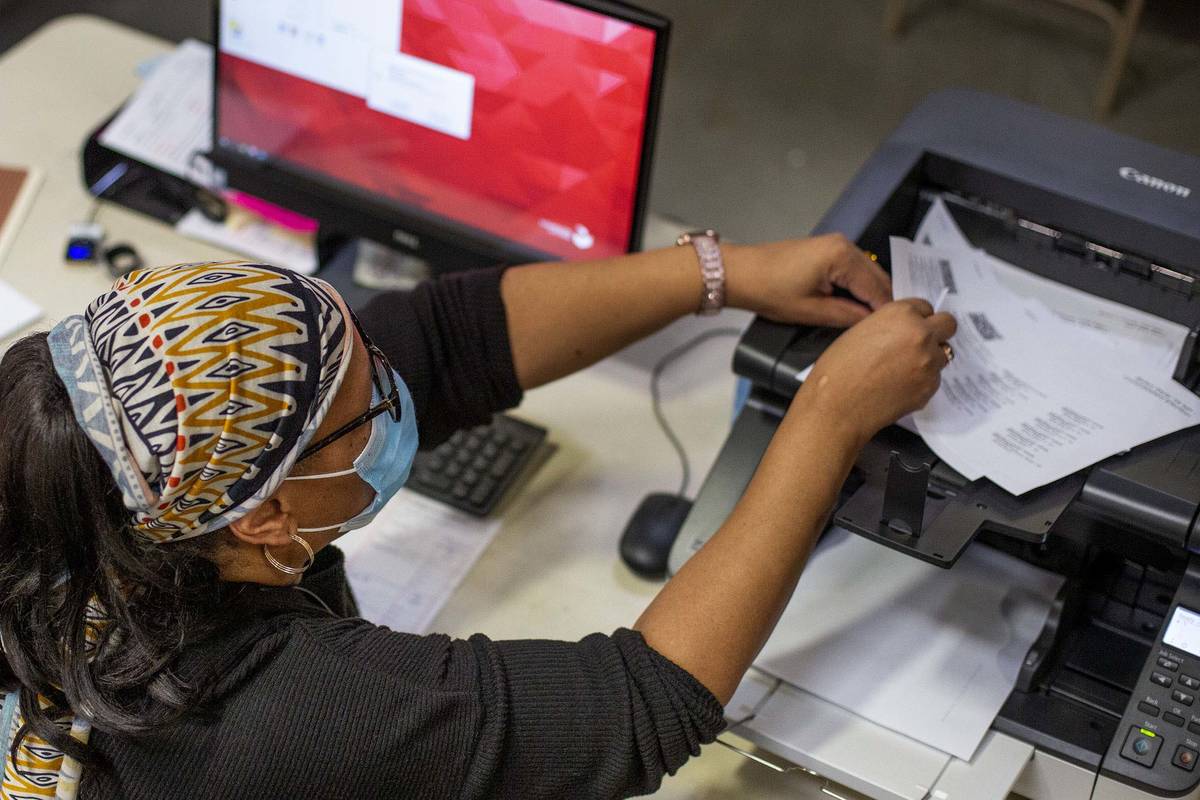 Mail-in ballots are counted at Clark County Election Center on Wednesday, Nov. 4, 2020, in Las ...
