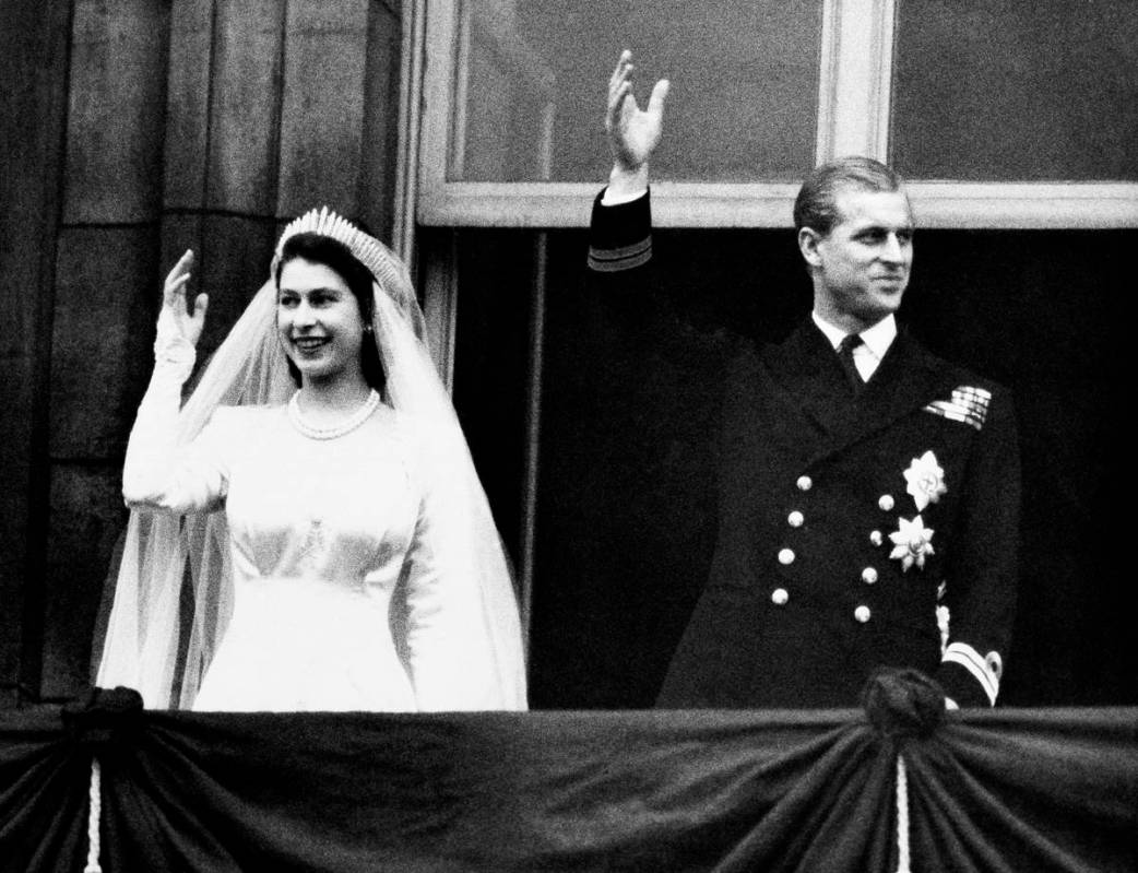 Princess Elizabeth and Prince Philip, Duke of Edinburgh make a charming picture as they wave t ...